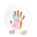 Kit d'empreintes de main pour 4 personnes en supports rond sur plexiglas de Ø26cm couleur pastel 